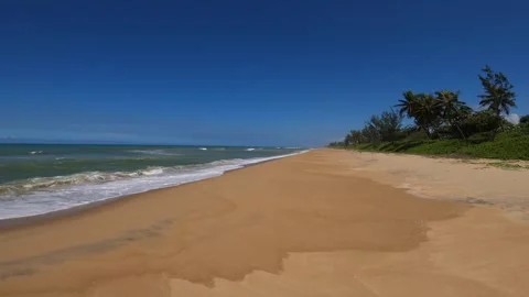 Ocean waves wash over sand beach along the eastern shore of Madagascar 스톡 동영상 310534366