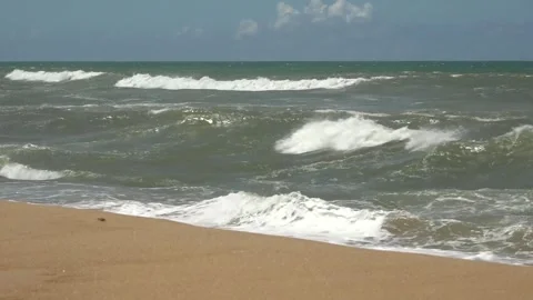 Ocean waves wash over sand beach along the eastern shore of Madagascar Video stock 313563585
