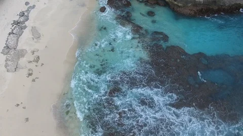 Ocean waves wash the shore of deserted beach Stock Footage 111777467