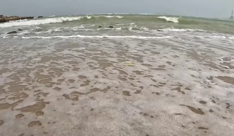 Ocean Waves Washing Over Sandy Beach with Small Pebbles Stock Footage 341464923