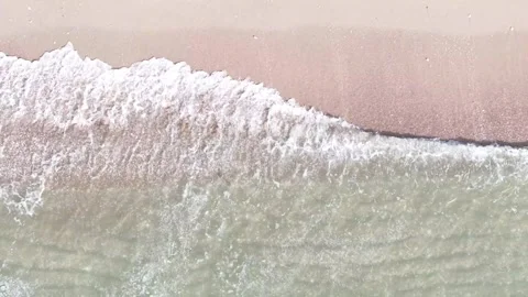 Ocean Waves Washing Over Sandy Beach From Above Stock Footage 345457155