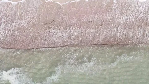 Ocean Waves Washing Over Sandy Beach From Above Stock Footage 345549798