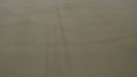 Ocean Waves Washing Over Wet Sand on Beach Overhead Slow Motion Stock Footage 239172709