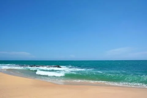 Ocean waves with white caps breaking on the shore. Indian Ocean, Sri Lanka Stock Photos