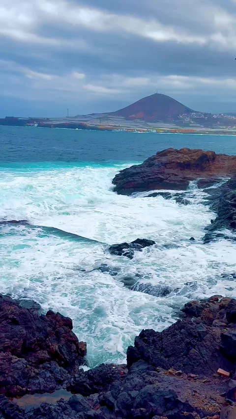 Ocean waves with white foam near a rocky shore. Gran Canaria island. Stock Footage 307420904