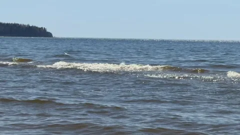 Ocean Waves with White Foam Under Clear Blue Sky Stock-Footage 334533750
