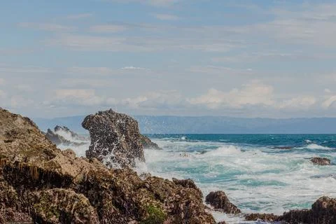 Ocean waves that will hit the rocks Stock Photos