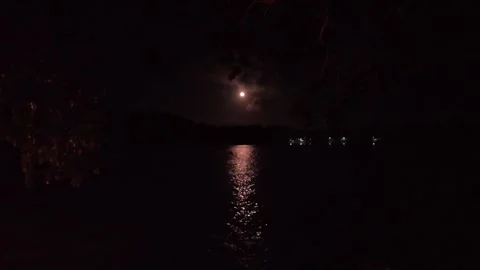Oceanfront bungalow view under the full moon Stock Footage 321260295