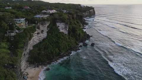 Oceanfront Cliff Villas at sunset Stock Footage 273142143