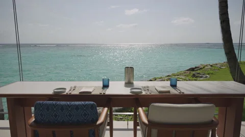 Oceanfront Dining Table for Two at The Ritz-Carlton Maldives Stock Footage 340876295