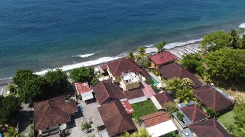 Oceanfront Elegance - Aerial Flight Around a House in North Bali Stock Footage 248209610