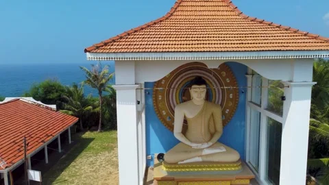 Oceanfront hillside temple with jungle backdrop Stock Footage 273018276