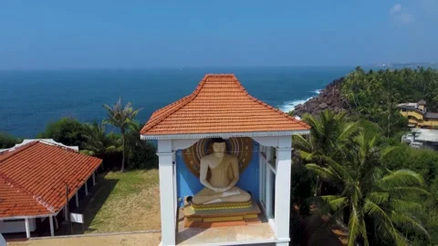 Oceanfront hillside temple with jungle backdrop Stock Footage 273018289