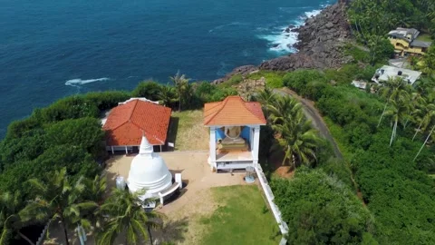 Oceanfront hillside temple with jungle backdrop Stock Footage 273018380