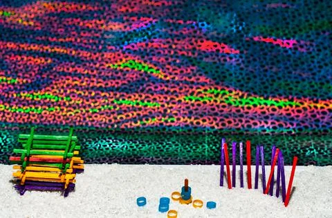 Oceanfront white sand beach with beach toys Stock Photos