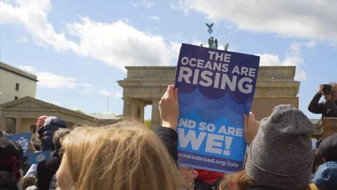 The oceans are rising, and so are we sign, March for Science protest, Berlin Stock Footage 87451092