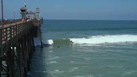 Oceanside pier with surfers Stock Footage 97146826