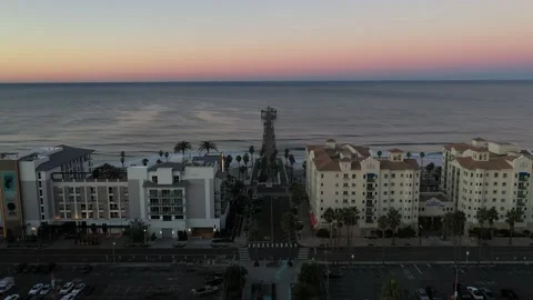Oceanside Surfers at dawn, drone shot, Oceanside pier, sunrise, ocean, Stock Footage 201764726