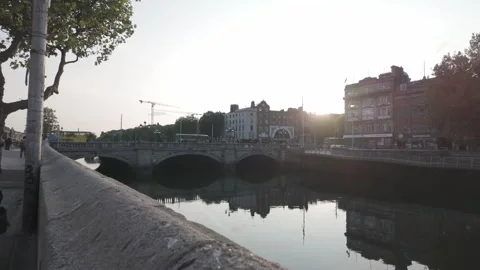 O'Connell Bridge over the River Liffey in Dublin, Ireland at sunset with urban Stock Footage 311759761