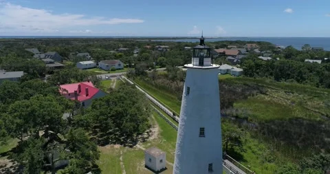 Ocracoke Lighthouse drone shot in the Outer Banks, North Carolina.   Video stock 134911465