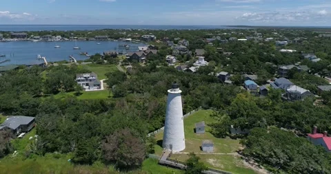 Ocracoke Lighthouse drone shot in the Outer Banks, North Carolina.   Video stock 134911582
