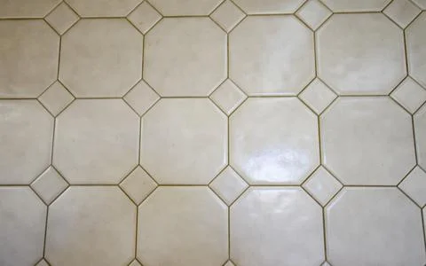 Octagonal and triangular white tile with grout lines 스톡 사진