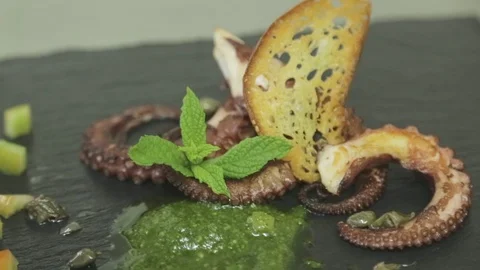 Octopus dish with mint leaf Stock Footage 88170848