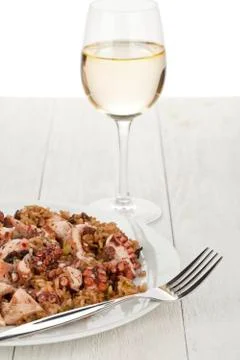 Octopus risotto with wine Stock Photos