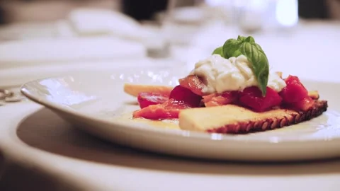 Octopus with stracciatella and vegetables. Stock Footage 147905211