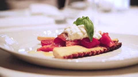 Octopus with stracciatella and vegetables. Stock Footage 147905218