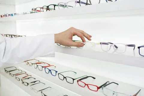 Oculist selects a frame for glasses Stock Photos