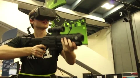 Oculus Rift Virtual Reality Gaming: User with headset and VR harness Stock Footage