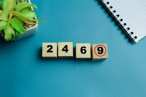 Odd one out logic puzzle with number cubes 2 4 6 and 9 text Stock Photos
