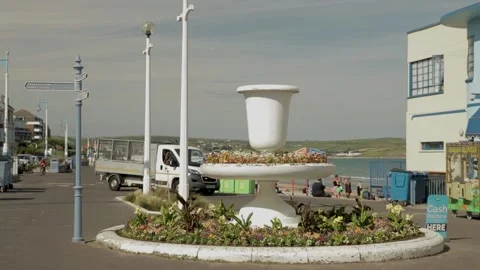 Odd shaped egg cup on weymouth front near art deco building 스톡 동영상 137267477