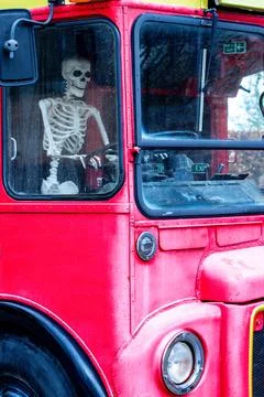 An Odd Sight Of A Skeleton Driving A Bus Stock Photos
