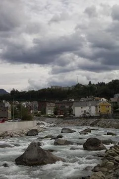 Odda town river rapids flowing through norway landscape Stock Photos