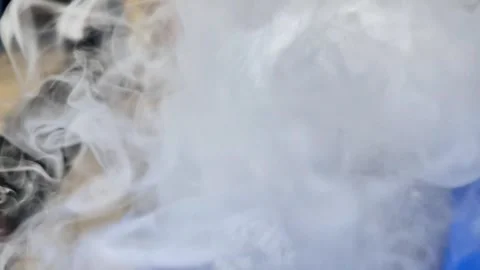 Oddly Satisfying Dry Ice Bubbles Spawning Thick White Smoke Clouds Video stock 330990976