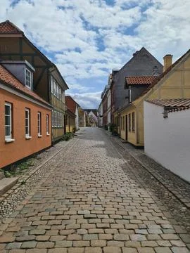 Odense, Denmark - 16. August 2026: Cobblestone street in Odense, Hans Chris.. Stock Photos
