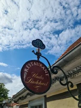 Odense, Denmark - 16. August 2026: Odense, Denmark restaurant sign Under Li.. Stock Photos