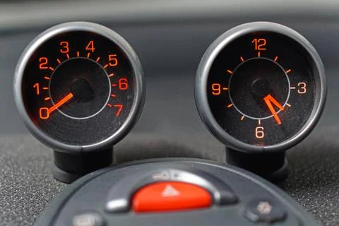 Odometer and clock Stock Photos