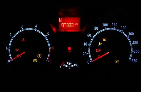 Odometer inside car in night time dark background Stock Photos