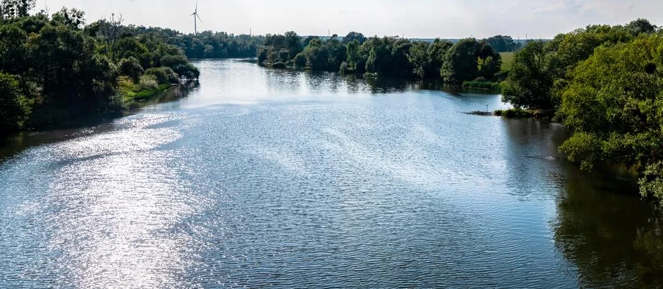 Odra river with bridge in background during summer Foto stock