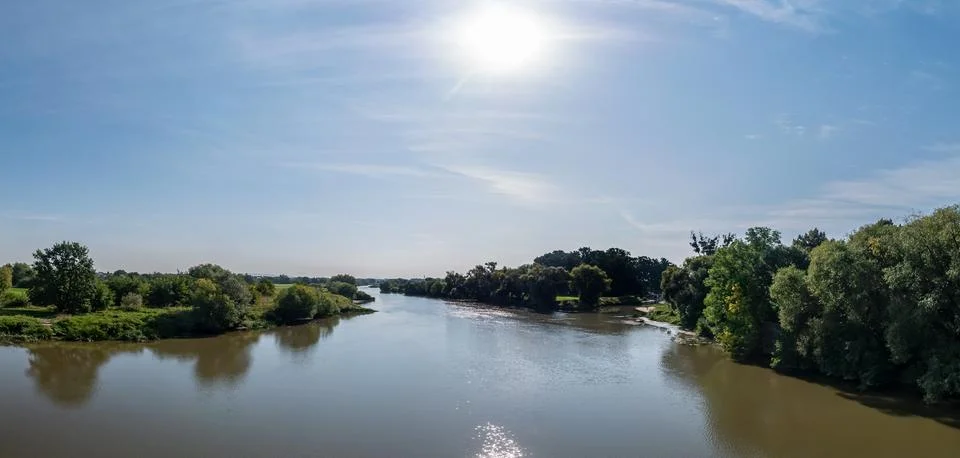 Odra river in summer with slightly cloudy sky and greenery Foto stock