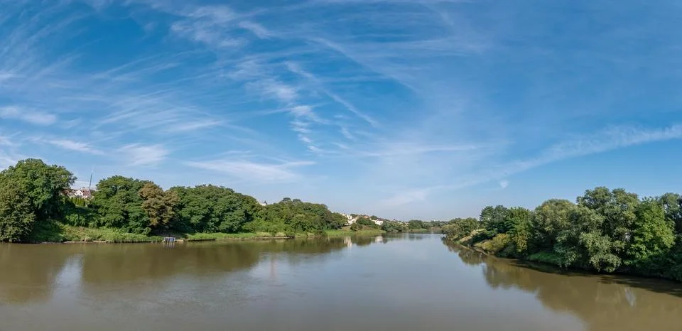 Odra river in summer with slightly cloudy sky and greenery Foto stock