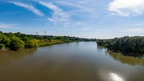 Odra river in summer with slightly cloudy sky and greenery Foto stock