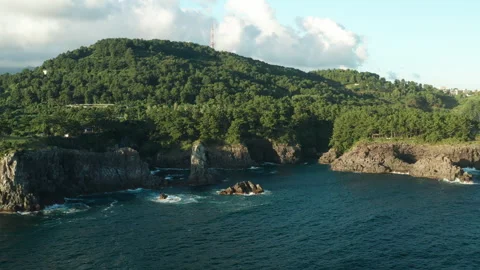 Oedolgae (외돌개) Sea Stack aerial view, Seogwipo, Jeju Island, South Korea Stock Footage 286217384