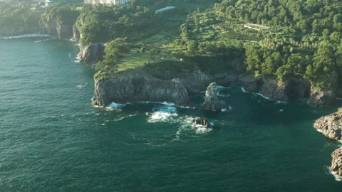 Oedolgae (외돌개) Sea Stack aerial view, Seogwipo, Jeju Island, South Korea Stock Footage 286221150
