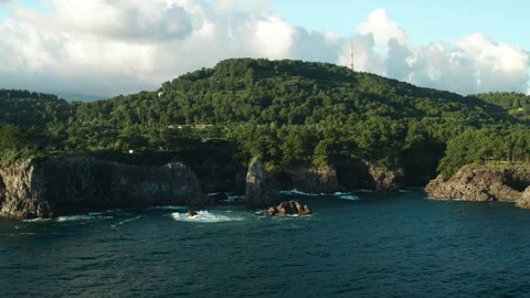 Oedolgae (외돌개) Sea Stack aerial view, Seogwipo, Jeju Island, South Korea Stock Footage 286221173
