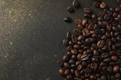 ?offee beans on black background with gold, space for text 스톡 사진