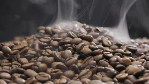 Offee beans rotate while roasting. Smoke comes from coffee beans. Stock Footage 119065953